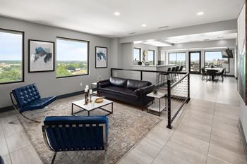 A living room filled with furniture and a large window